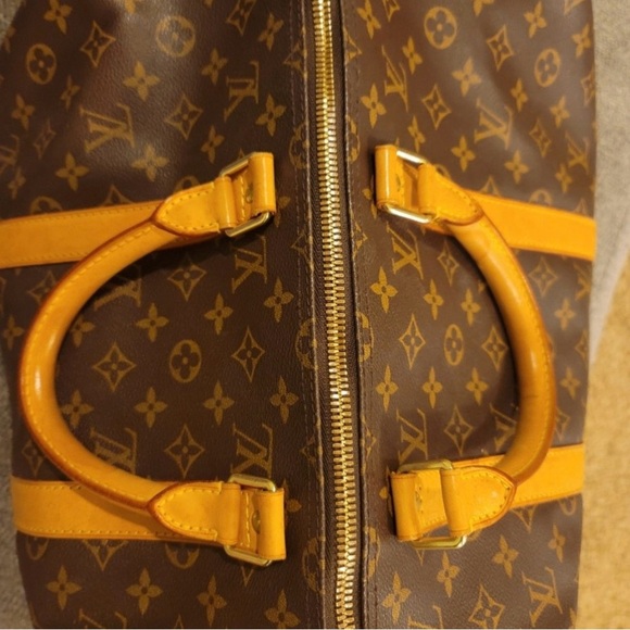 I’m selling a brown and tan Louis Vuitton travel bag. - Picture 6 of 7
